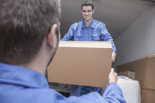 Removal team supporting a move in Paddington with packed boxes