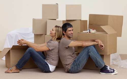 Professional movers handling stairs and access in central London