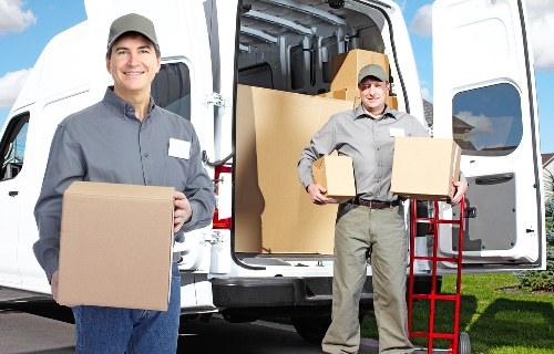 Office movers preparing boxes and equipment for transport