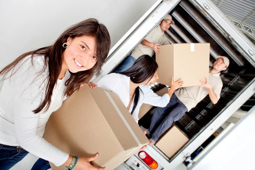 Loading furniture into a van for a Paddington delivery