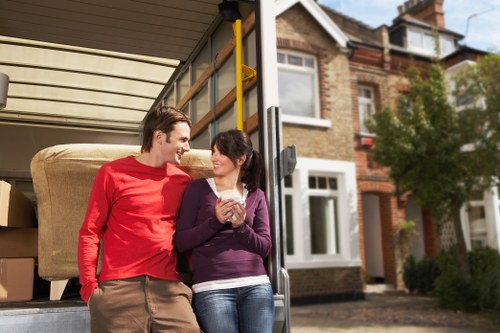 Removalists navigating stairs in a Paddington home